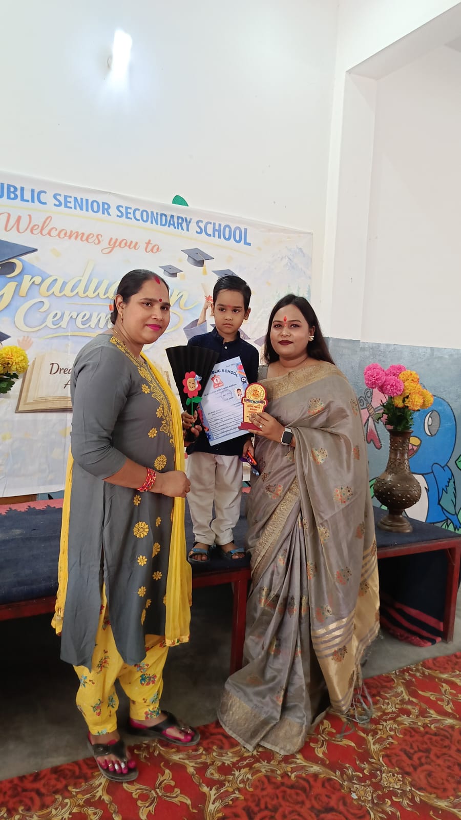 Prize Distribution — Student Receiving Trophy on Stage